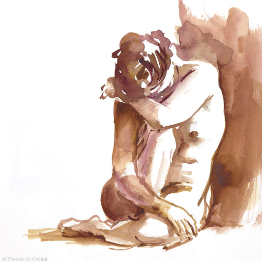 Femme assise qui se cache le visage